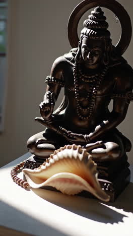 hindu god statue with conch shell