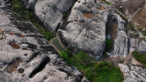 rock formation in brazilian jungle - high angle aerial view