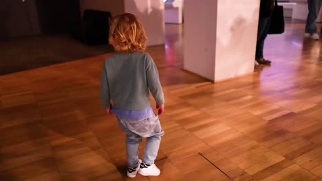 a child walking through an indoor area