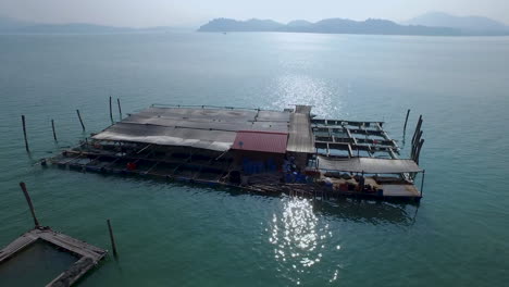 primitive fish farm cage system in tropical island of malaysia