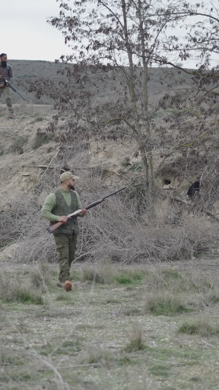 Hunters in a rural landscape