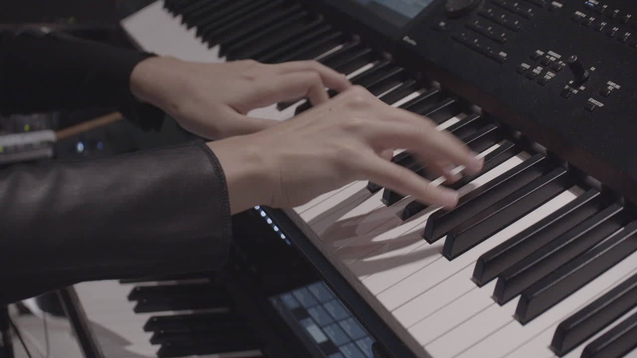 Close-up Hands Playing Electronic piano