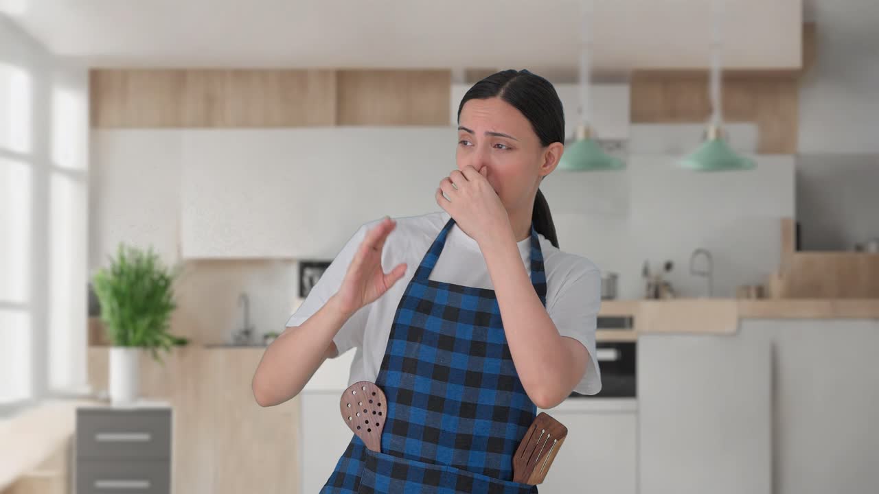 Sad Indian housewife disgusted by bad smell