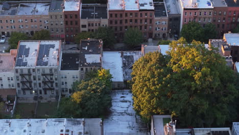 aerial view of a densely populated city neighborhood at sunset