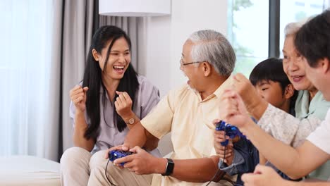 a multigenerational family enjoys playing video games together, showcasing joy and connection in a bright living room setting