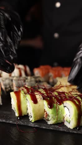 sushi chef preparing rolls