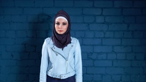 stylish woman in hijab and leather jacket