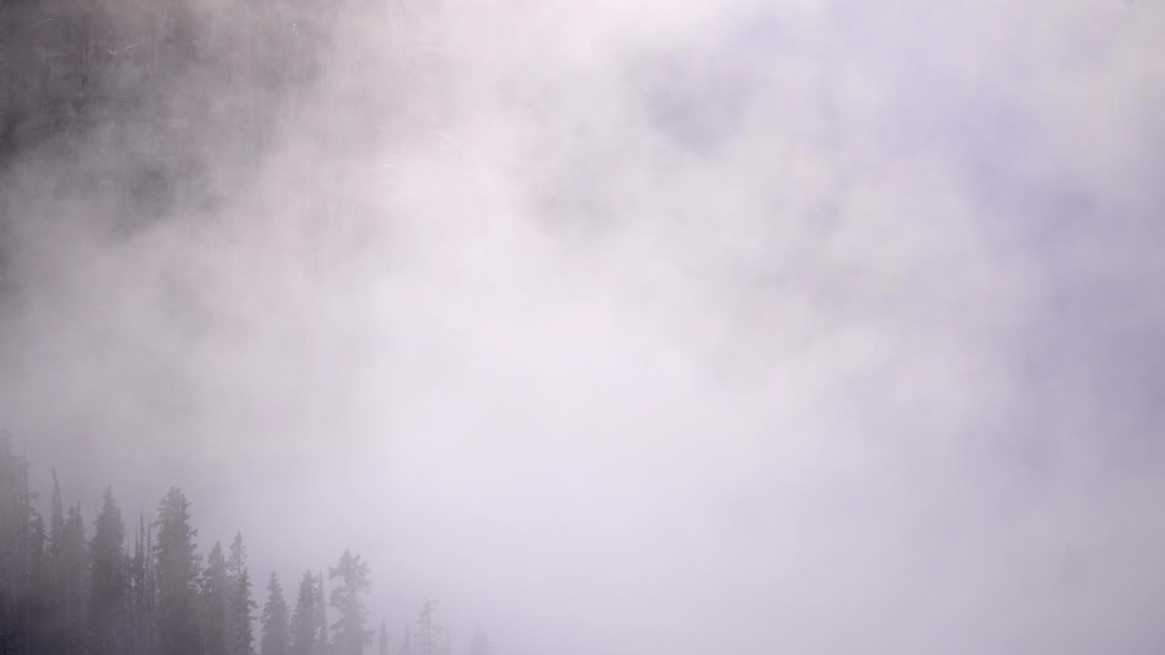 Timelapse of rolling clouds in the mountain of the Canadian Rockies.