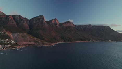 twelve apostles mountains at sunset in cape town - aerial drone shot