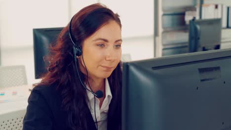 Business-people-wearing-headset-working-in-office