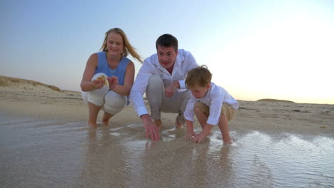 family spending time by the sea