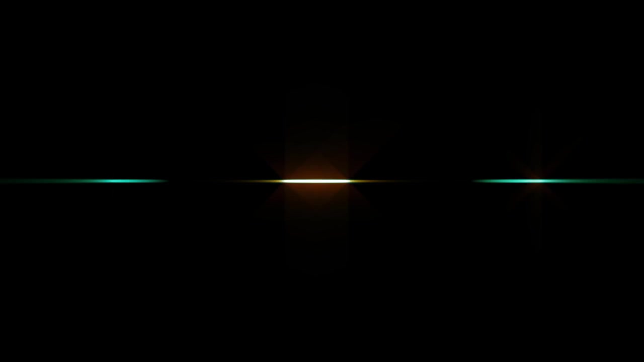 Fascio di luce verde e arancione in rapido movimento su sfondo nero