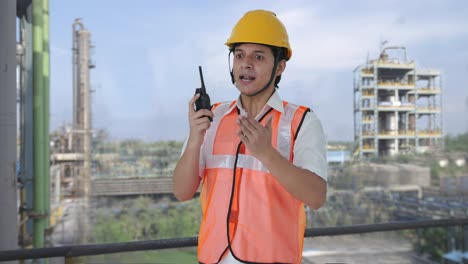 angry indian architect shouting on walkie talkie