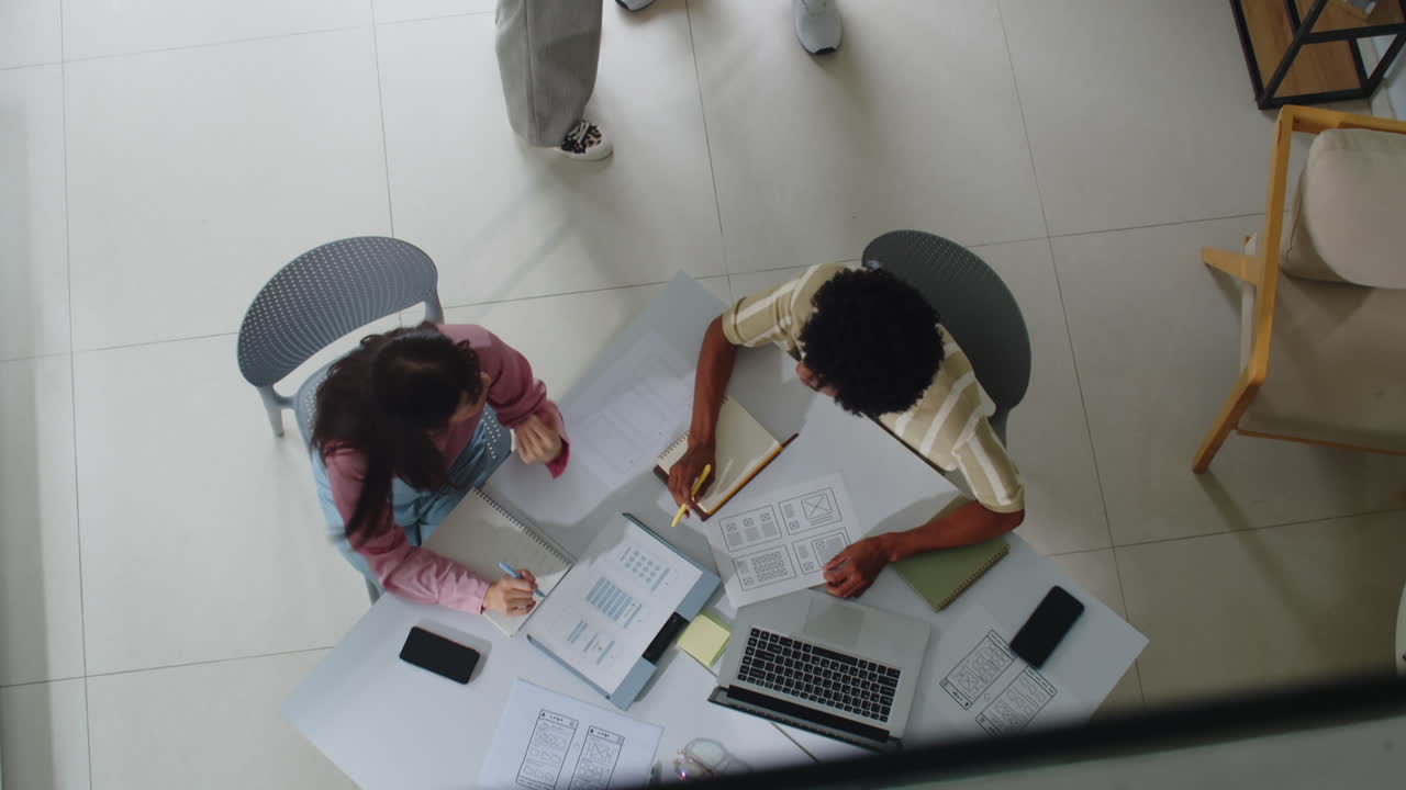 Multicultural Colleagues Working in Startup Office