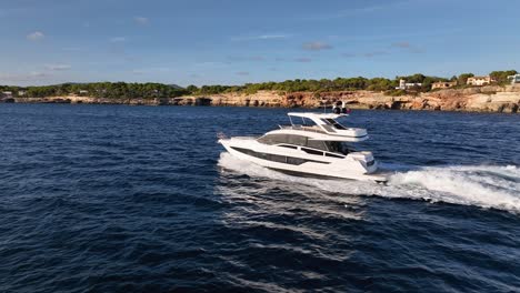 drone circling luxury yachts while driving along mediterranean coastline