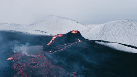 newly formed shield volcano ejecting orange lava steadily flowing out, aerial