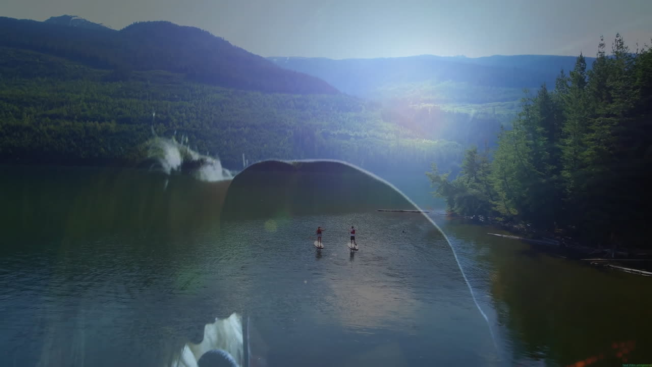 two friends paddling on mountain lake at sunrise for health, with animated sun flare icons