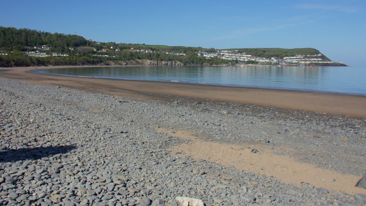 Extra wide shot of new quay bay next to the river Gido on new quay beach. On upper third of frame