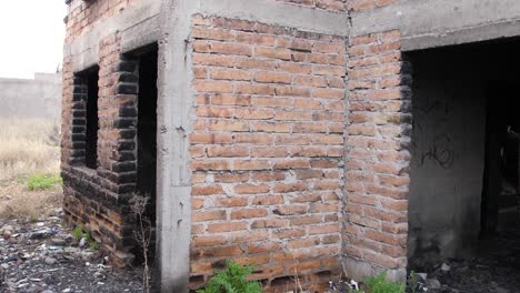Heavily-damaged-abandoned-burned-old-brick-house-structure