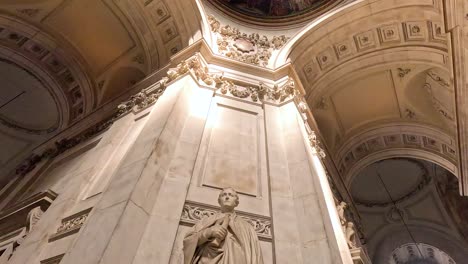 statue illuminated by sunlight inside cathedral