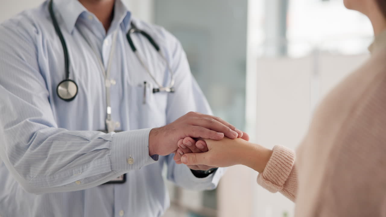 Doctor comforting patient