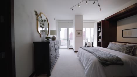 modern-bedroom-with-bright-windows-in-a-downtown