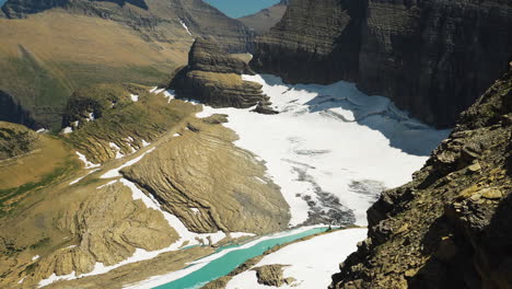 Magical-view-of-sun-shining-bright-through-snow-capped-mountains-of-national-park-during-winters