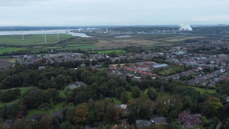 Aerial-view-above-Halton-North-England-Runcorn-Cheshire-countryside-wind-turbines-industry-landscape-rising-forward