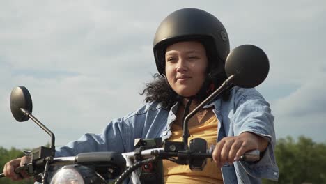 tough young female on an electric scooter