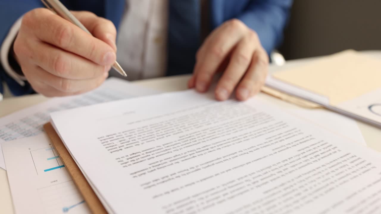 Businessman examining text of contract and putting signature on document 4k movie