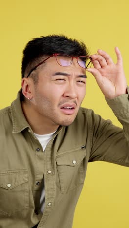 man with glasses listening