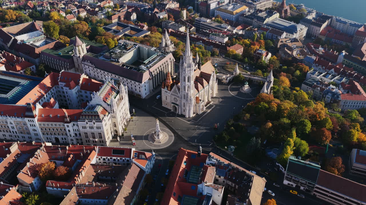 Budapest’s skyline glows in sunlight, with Matthias Church at the center, framed by the Danube and Margaret Island’s lush greenery