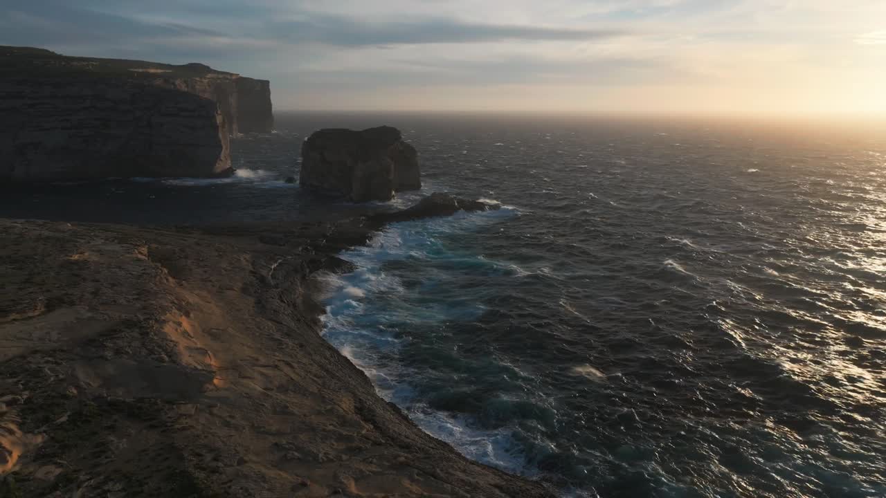 Dramatic Limestone Cliffs At Dwejra Bay On The Island Of Gozo In Malta. Aerial Rotate Shot