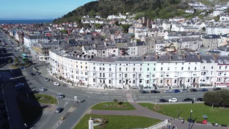 beachfront aerial view llandudno seaside coastal holiday town tourism resort hotels reverse dolly left