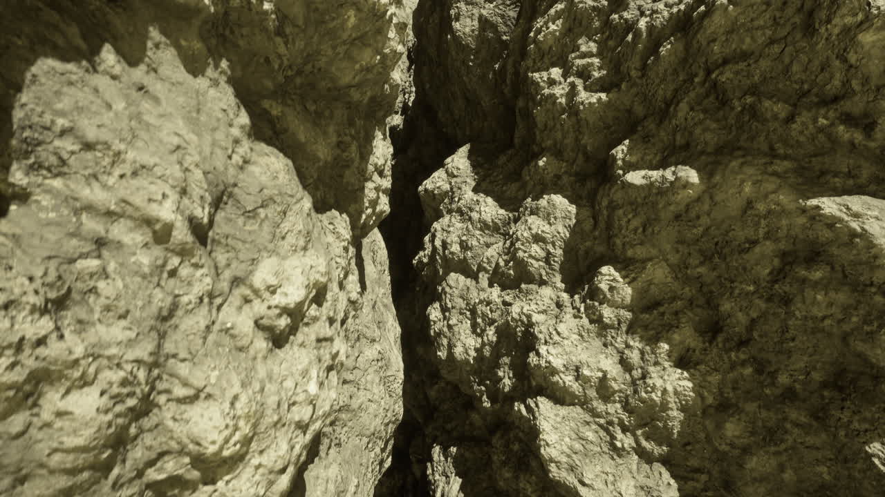 Detailed view of rocky terrain in a narrow canyon during daylight hours