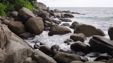 waves crashing on a rocky tropical coastline