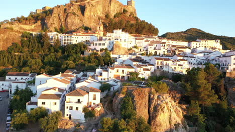 AERIAL---Cityscape-of-Zahara-de-la-Sierra,-Cadiz,-Spain,-wide-shot-reverse