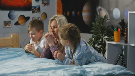 family praying together in bedroom