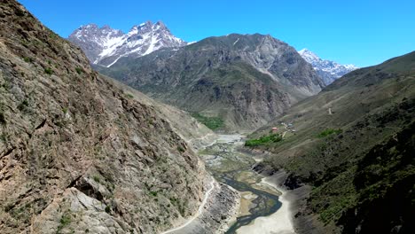 Beautiful-cinematic-drone-shot-high-altitude-mountain-range-in-sun