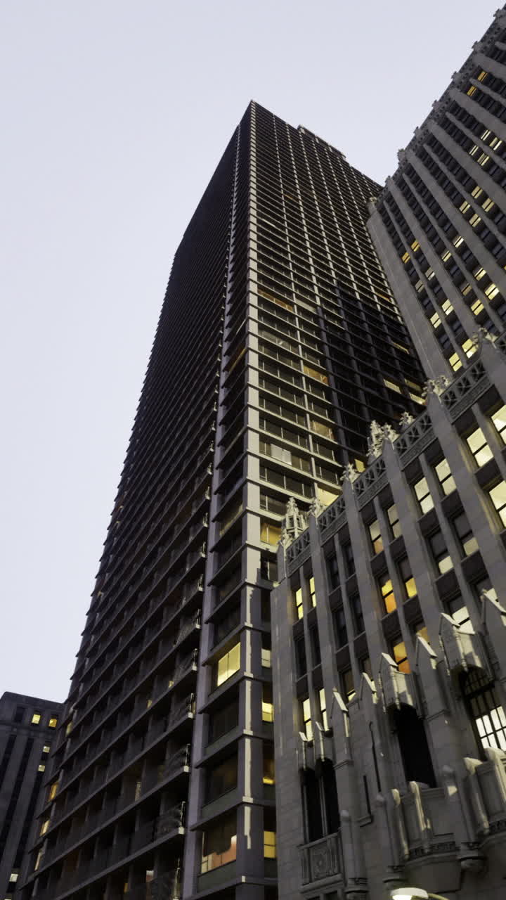 Skyscrapers rise above the city streets during twilight in an urban setting