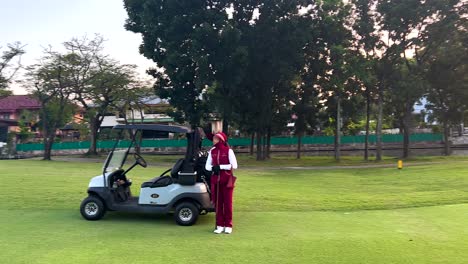 golf course sunset view with caddy