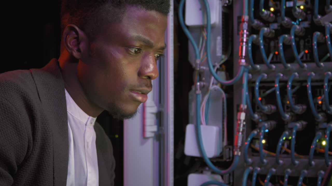 African-American Network Engineer Working in Data Center