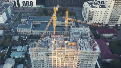 aerial view of construction site with cranes