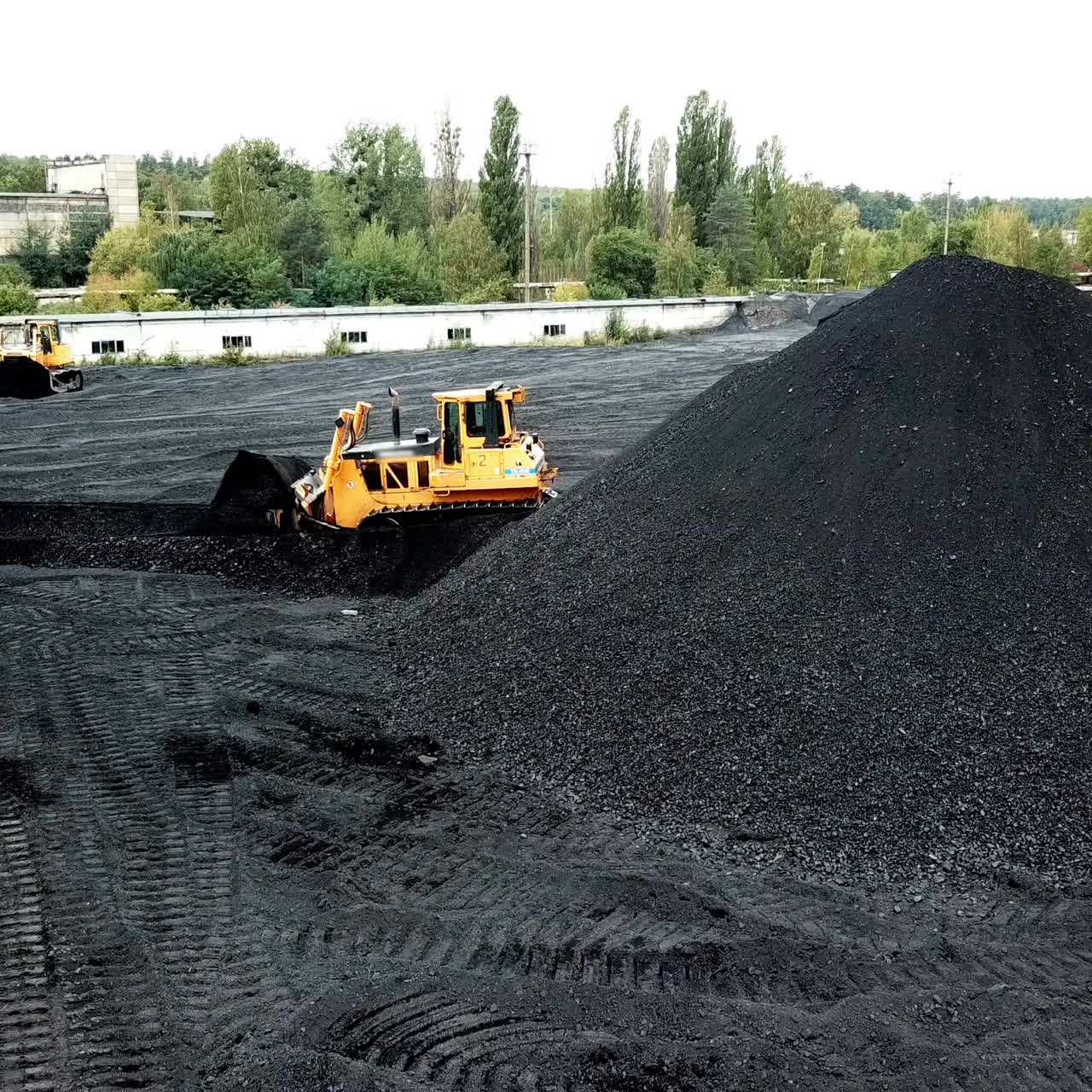 Aerial view of big pile of coal. Extractive industry, anthracite.