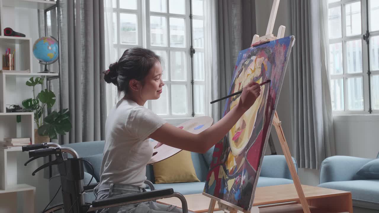 Woman in Wheelchair Painting a Portrait