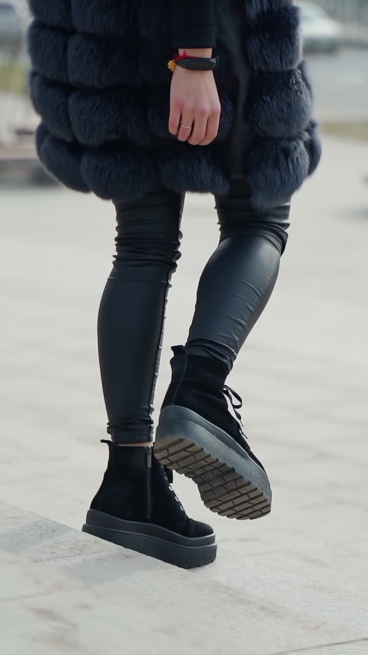 Woman Wearing a Dark Blue Fur Coat