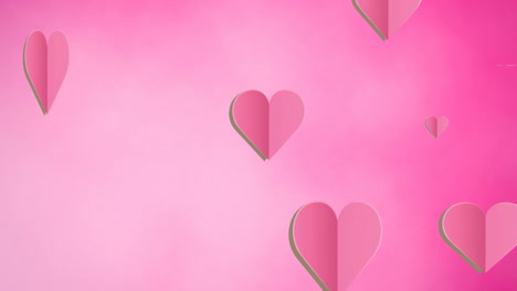 animation of falling pink hearts on pink background