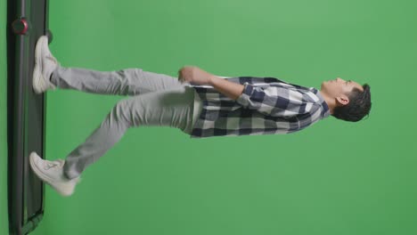side view full body of asian man walking in green screen background