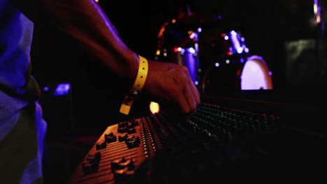 man using dj mixer at nightclub 4k