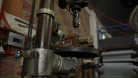 Slow dolly in of a static drill in a warehouse